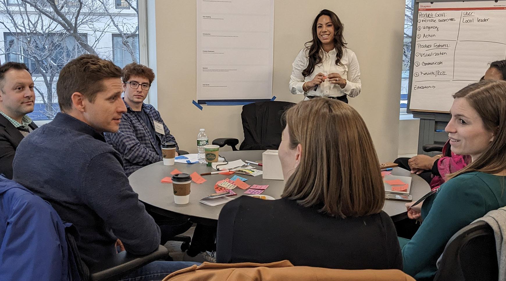 A group of people chatting in a meeting