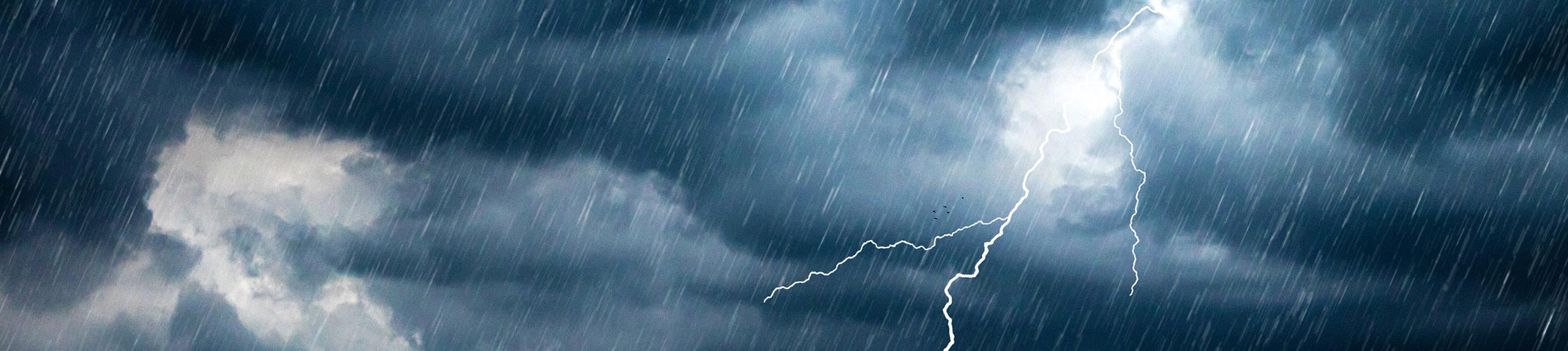 Thunderstorm clouds with a lightening strike
