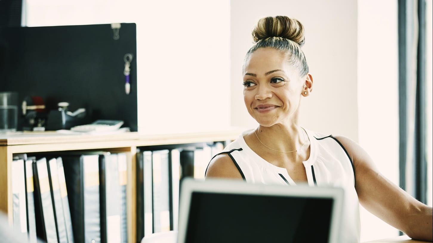 Woman sitting down in an open space