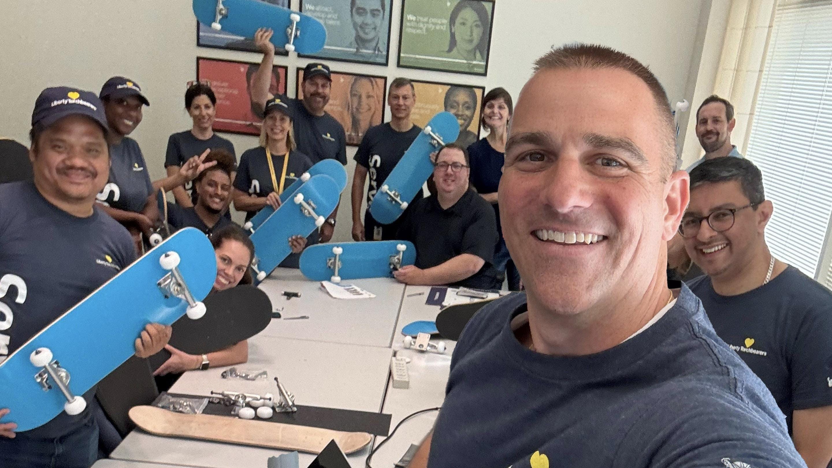 (slide 6 of 8) Brian Burgess of Liberty Mutual volunteering/smiling to camera.