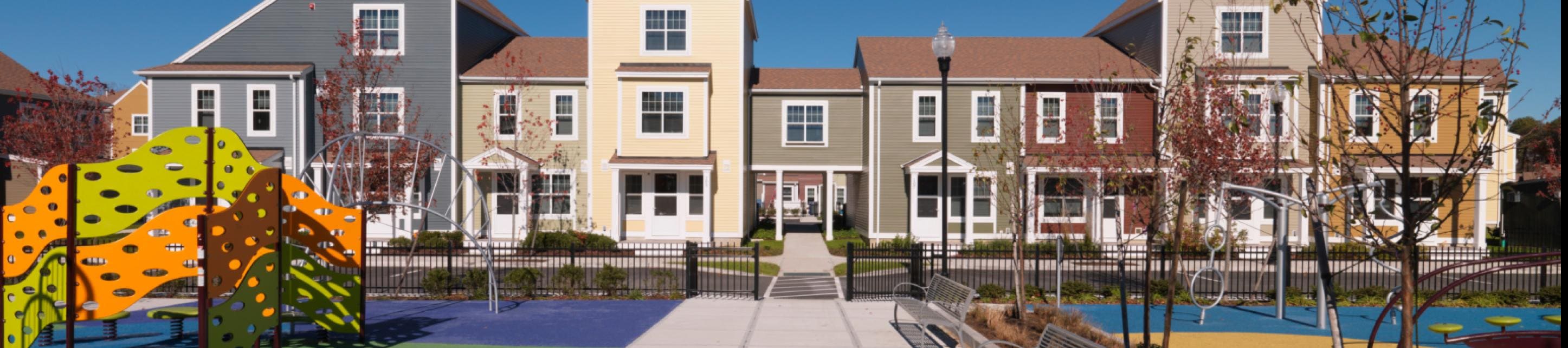 an exterior shot of a row of townhomes